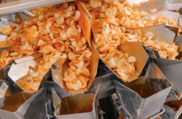 Food-grade packaging process handling snack products in sanitary production equipment