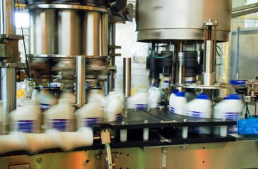 Turnkey packaging line filling and capping bottles on automated production system