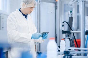 Operations strategy in action with technician analyzing production process in facility