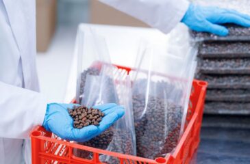 Private label manufacturing packaging coffee beans into branded retail-ready pouches